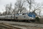 AMTK 49 leads train 80 towards the station